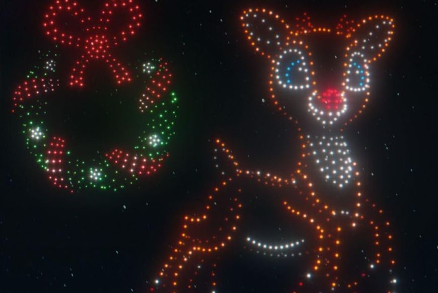 an image of rudolph and a christmas reef, made of shining dots on a black night sky